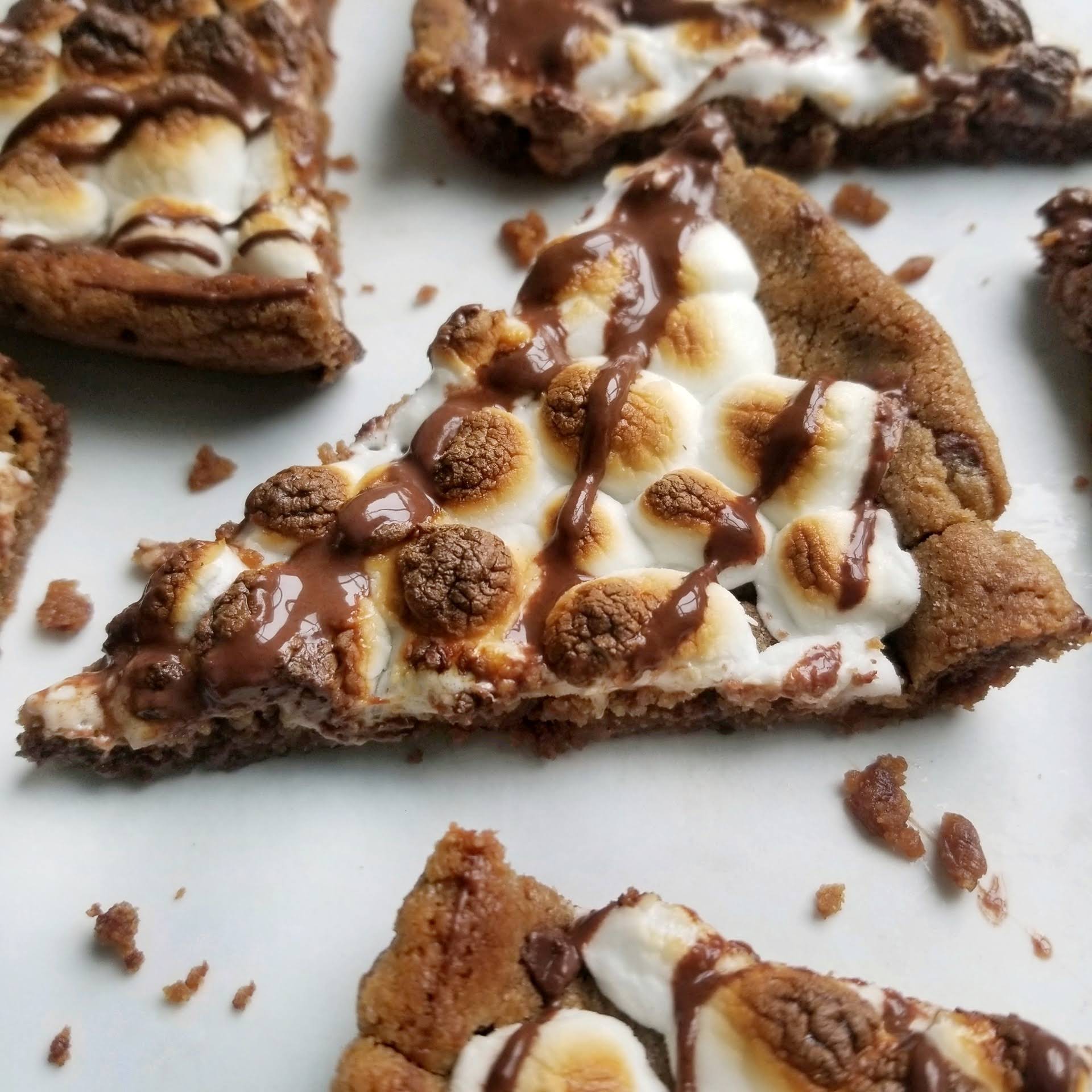Gluten free Sweet Loren's s'mores cookie cake with toasted marshmallows and chocolate drizzle