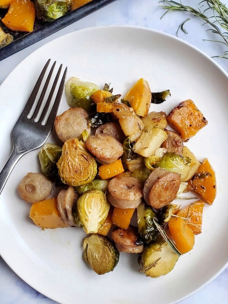 easy sheet pan dinner made with chicken sausage, butternut squash, apples and brussels spouts