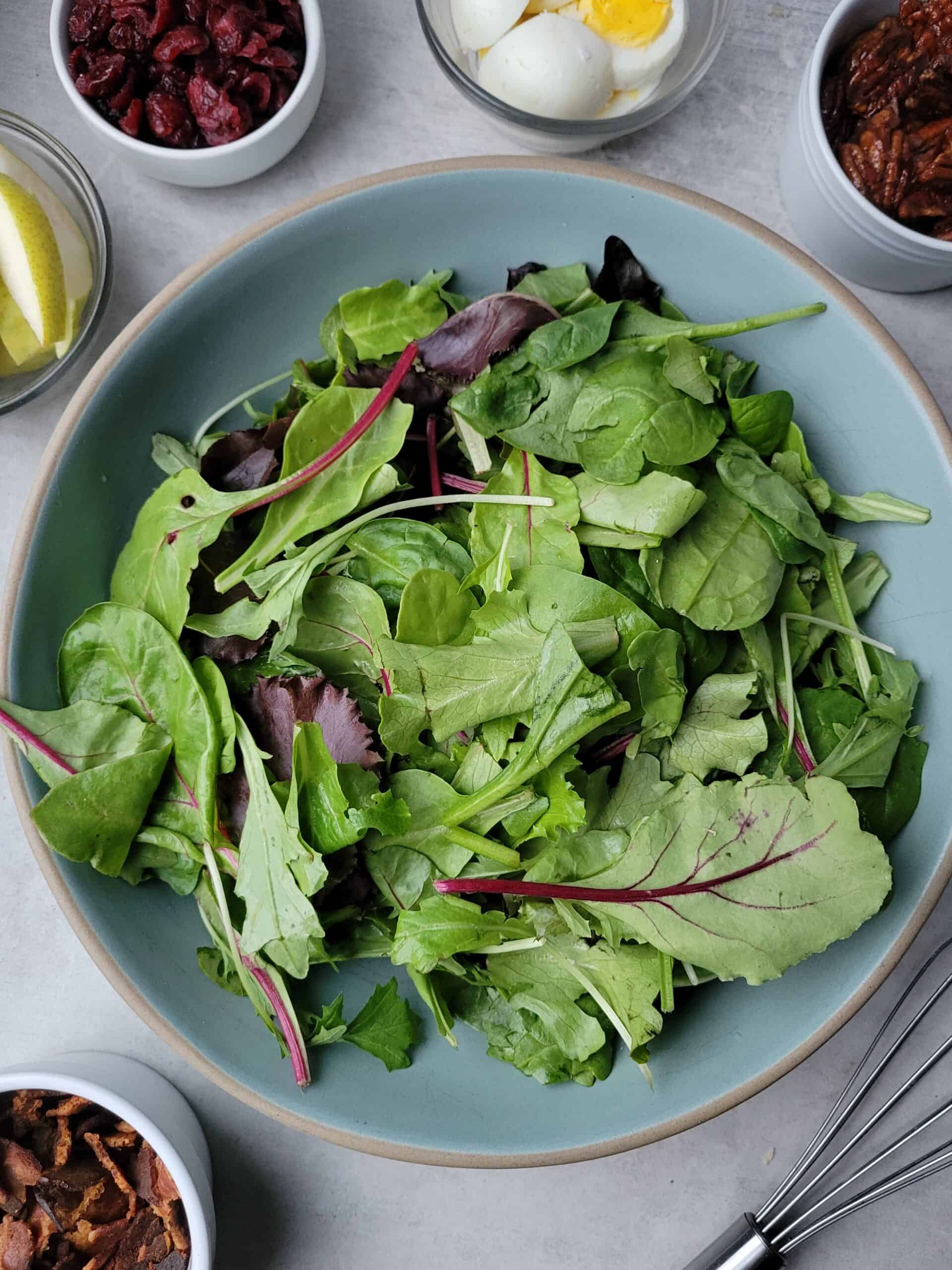 winter cobb salad recipe with cranberries, bacon, pears and hard boiled eggs