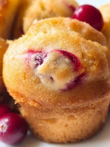 gluten free and dairy free cranberry orange muffins recipe with orange glaze.