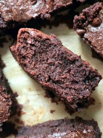 Close up of fudgy homemade gluten free brownies cut into squares