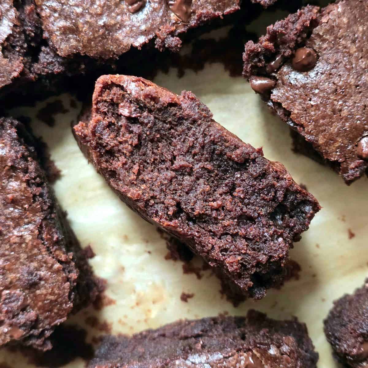 Close up of fudgy homemade gluten free brownies cut into squares