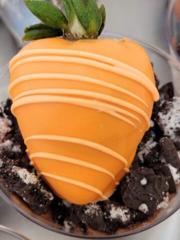 Gluten free chocolate dirt cups topped with strawberry carrots for Easter