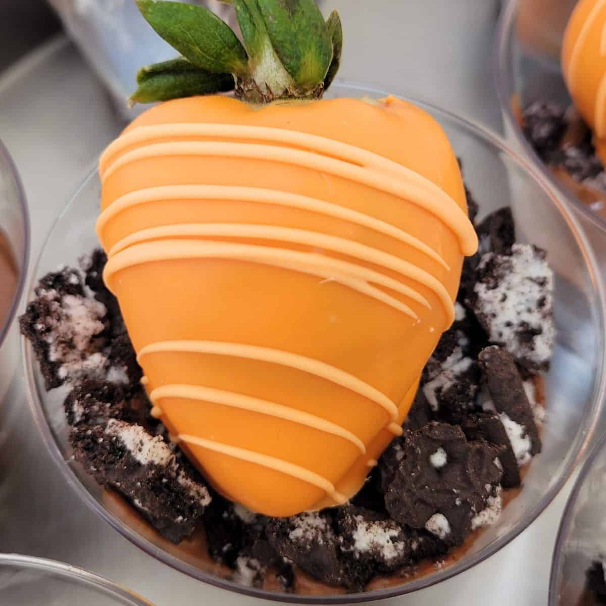 Gluten free chocolate dirt cups topped with strawberry carrots for Easter