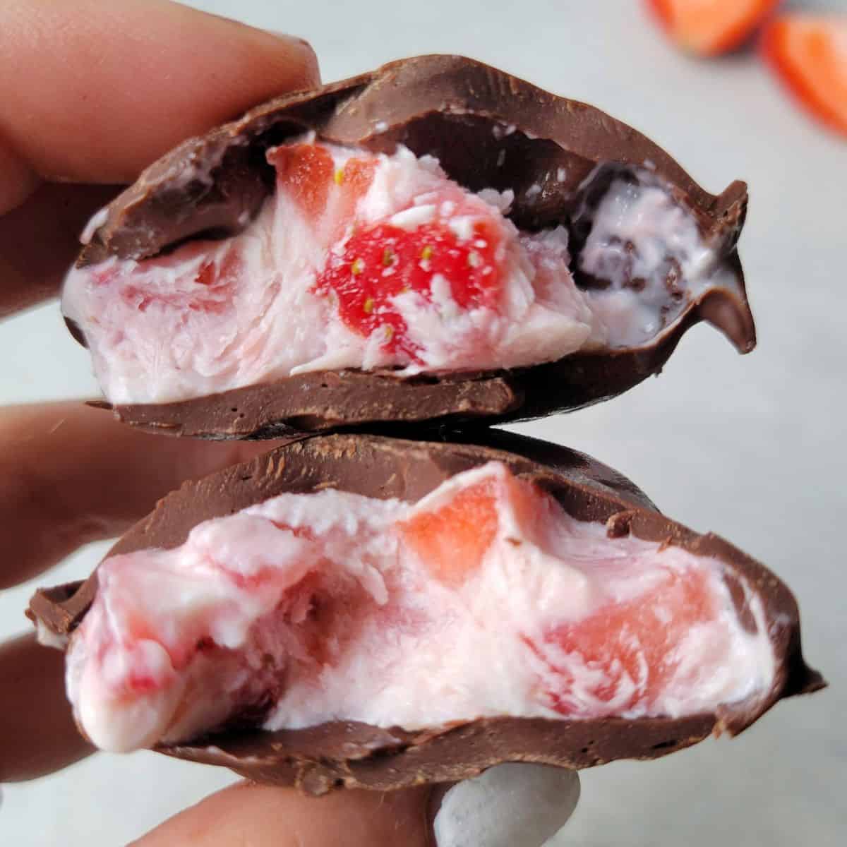 Frozen strawberry yogurt clusters with creamy yogurt and chocolate coating.