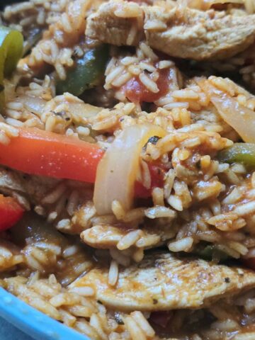one pan chicken fajita and rice skillet with peppers and onions