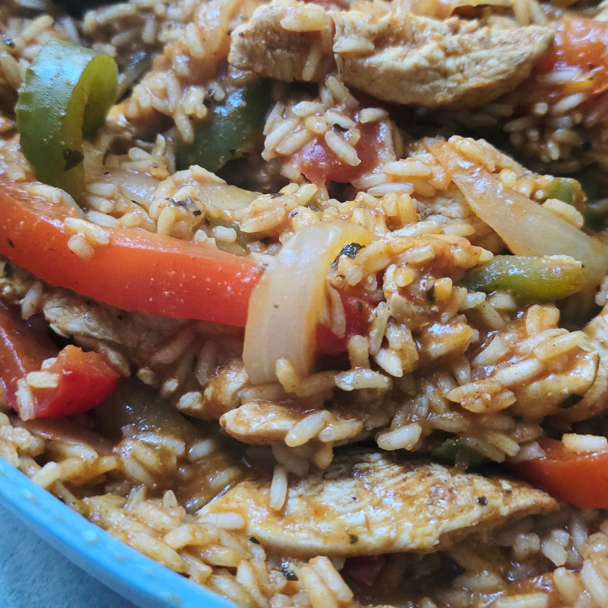 one pan chicken fajita and rice skillet with peppers and onions
